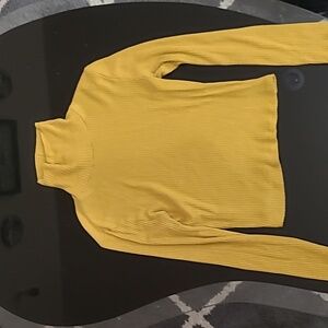 Mustard yellow turtle neck.